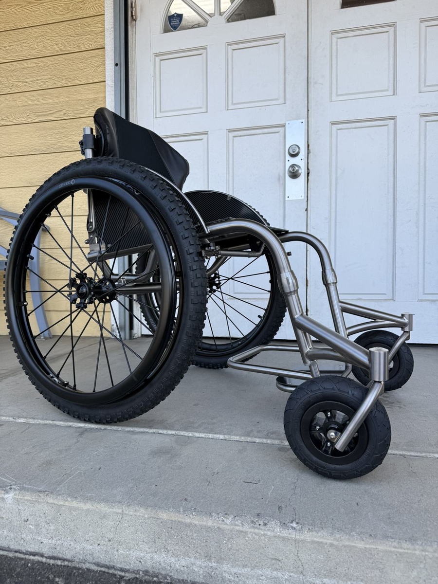 An HOC wheelchair configured for power assist or rough terrain.