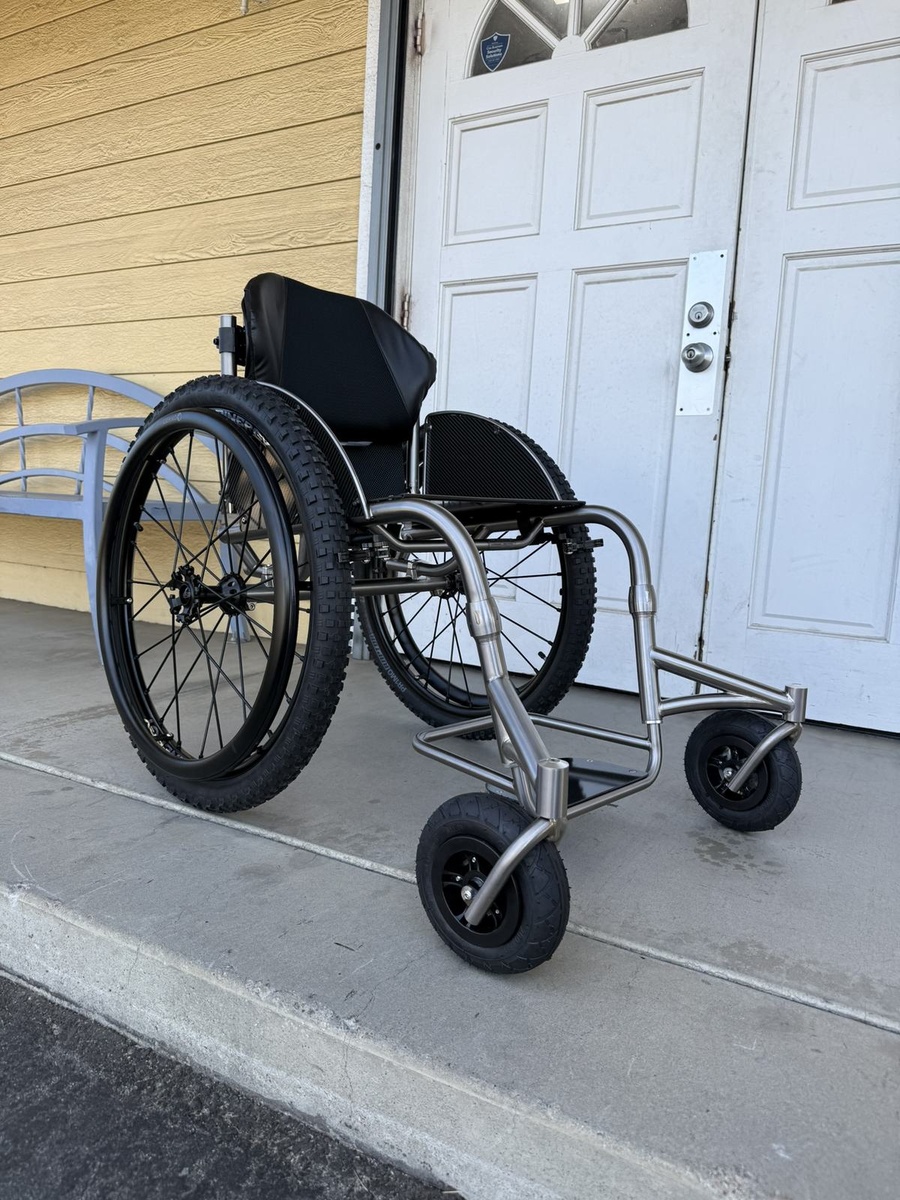An HOC wheelchair configured for power assist or rough terrain.