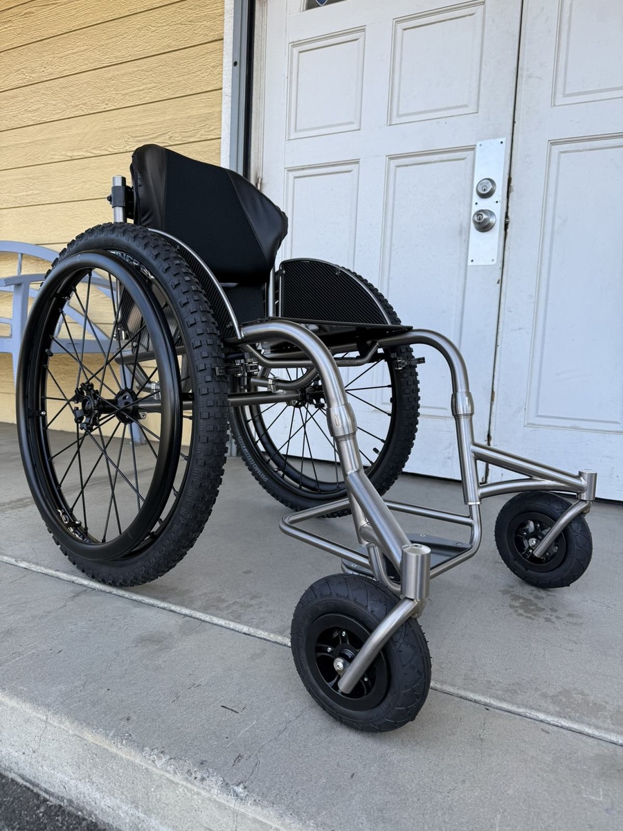 An HOC wheelchair configured for power assist or rough terrain.