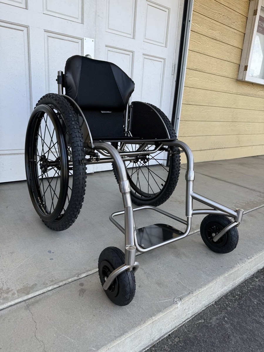 An HOC wheelchair configured for power assist or rough terrain.