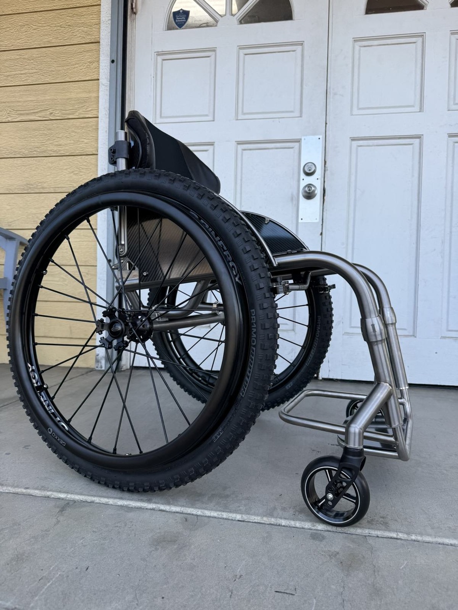 A travel-ready HOC wheelchair with folding or coupler features.