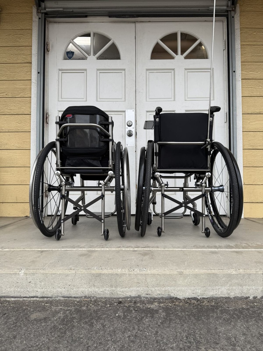 A travel-ready HOC wheelchair with folding or coupler features.