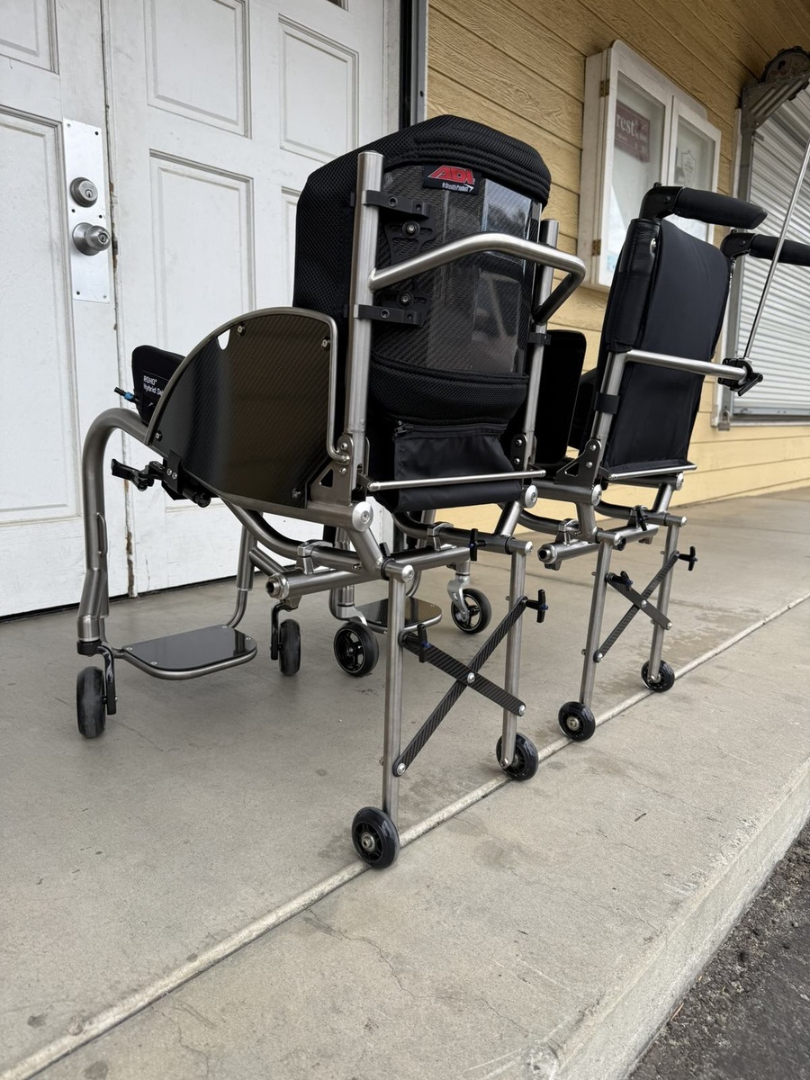 A travel-ready HOC wheelchair with folding or coupler features.