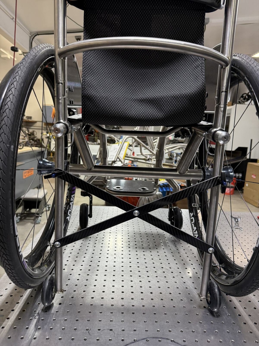 A travel-ready HOC wheelchair with folding or coupler features.