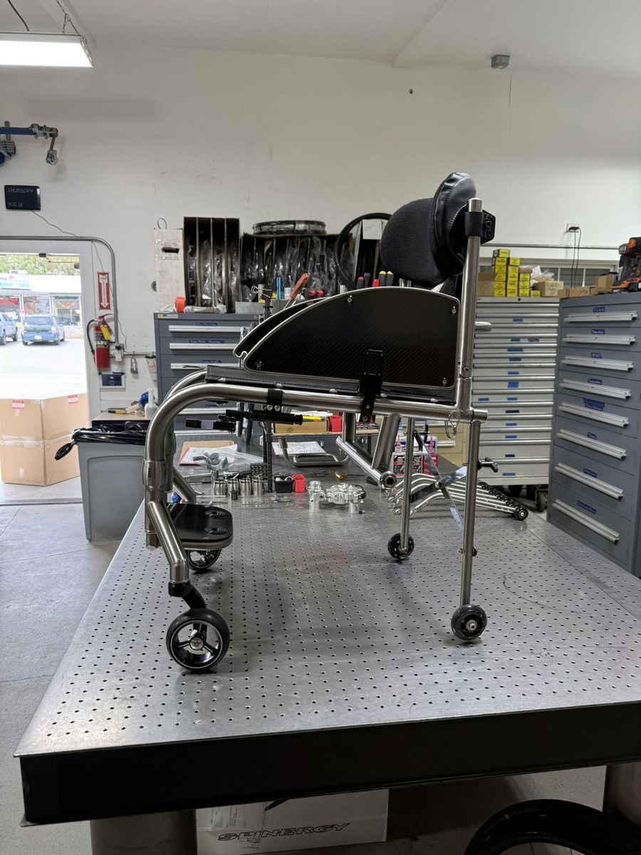A travel-ready HOC wheelchair with folding or coupler features.