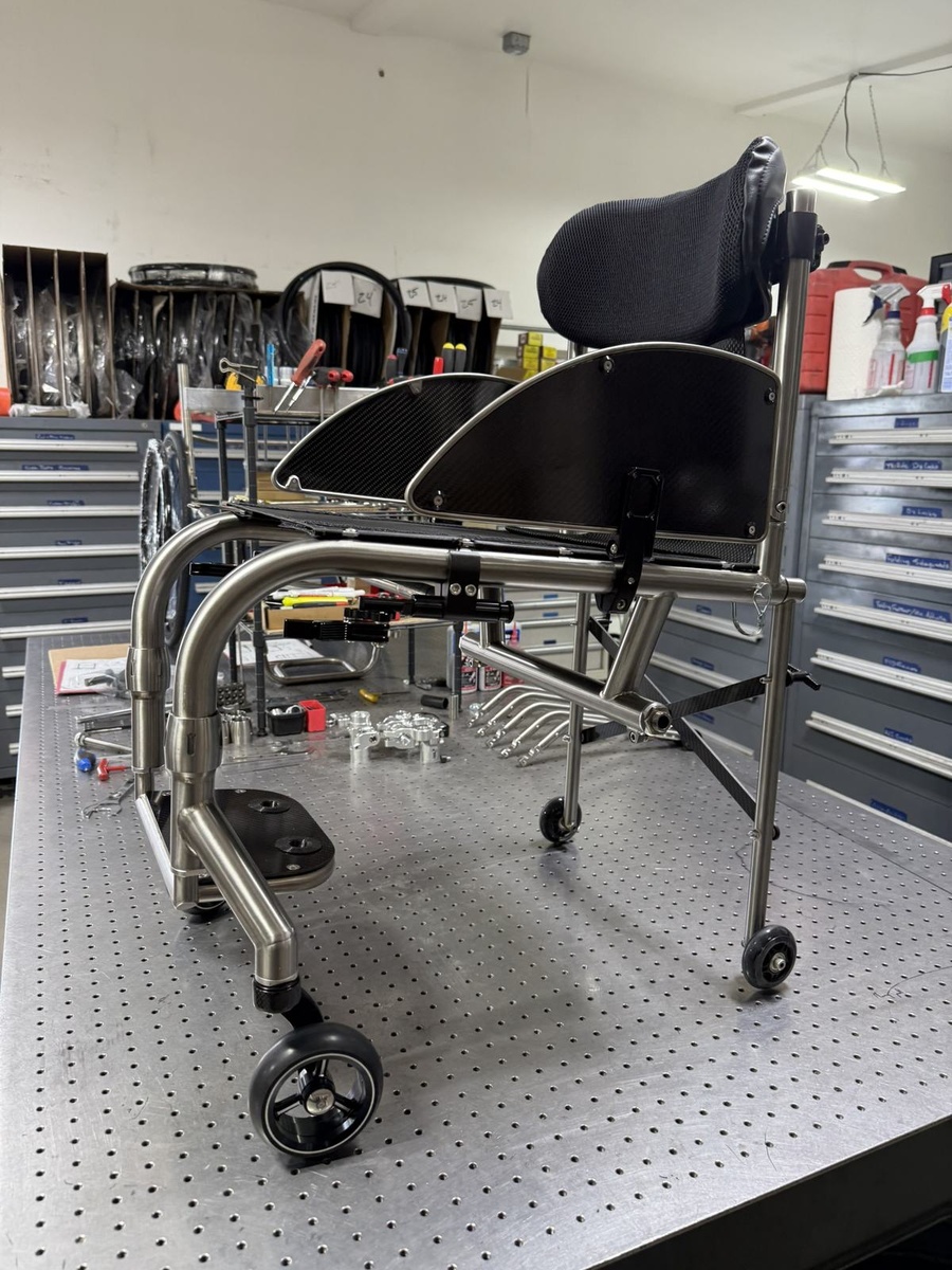 A travel-ready HOC wheelchair with folding or coupler features.