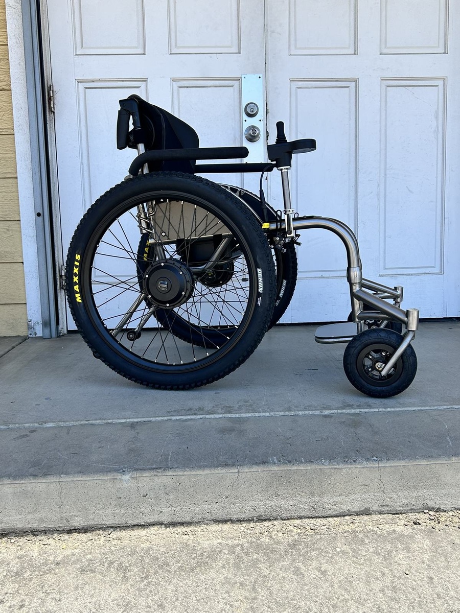 An HOC wheelchair configured for power assist or rough terrain.