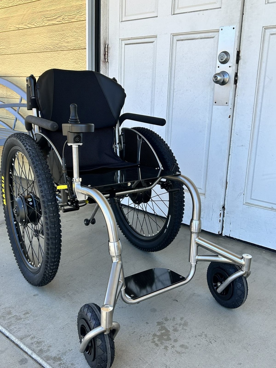 An HOC wheelchair configured for power assist or rough terrain.